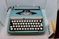 Front view showing Smith Corona Corsair Deluxe typewriter keyboard and platen