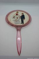 Full view of pink acrylic hand mirror