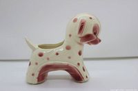 Side profile showing overall shape, color, and spot pattern