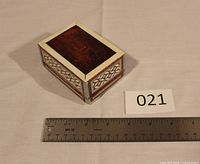 Box closed, ruler for scale