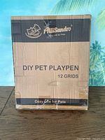 Front of sealed Alessandro DIY Pet Playpen box showing branding and product name