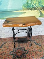 Full view of table showing cypress top and cast-iron treadle base