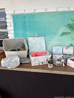Overview of craft supplies and storage boxes on table