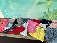 All garments laid out together on table