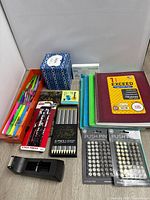 Overall lot view showing all stationery items