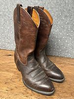 Full view of both boots side by side showing overall condition