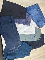 All eight garments laid out showing colors and styles