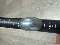 Top view of ring on mandrel showing stone and size indicators