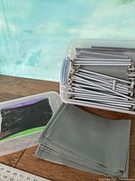 Overall kit: fabric panels stacked, metal tubes, tote