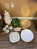 Group shot showing Mikasa plates, Continental Ivory pieces, cookie jar, fruit topiary and chargers