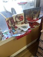 Overview of books, platter, napkin rings, serving tray, napkin rings, linens