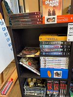 Shelf showing multiple DVD box sets including Lucifer, Planet of the Apes, McMillan & Wife and others