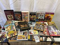 Overall view of all DVDs and VHS tapes laid out on table