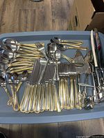 Wallace stainless flatware with gold trim plus servers in tote