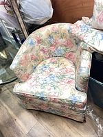 Tub-style chair showing overall form and upholstery