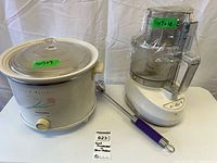 Slow cooker, food processor and whisk grouped