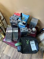 Group shot of all cologne boxes and toiletry bag