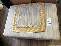 Top view showing ottoman surface and pillow cover