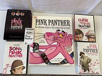 Full lot view showing book and four DVD cases