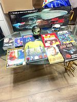 Group shot of all Star Trek items on glass table