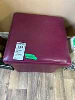 Top view of burgundy vinyl cube ottoman with lid