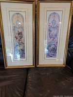 Both framed prints side by side showing frames and glazing