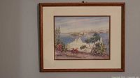 Framed lithograph showing Bermuda harbour scene, mat and wooden frame visible