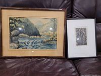 Both framed artworks on sofa for scale