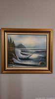 Full view of framed seascape painting on wall