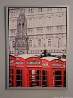 Full shot of framed art print showing red telephone booths and London architecture