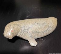 Left side and head view of soapstone walrus carving