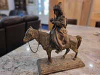 Full view of metal sculpture on countertop