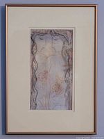 Full view of framed artwork showing metallic frame, mat and image contents