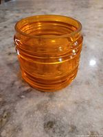 Side view of amber ribbed glass shade lens