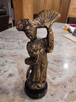 Full view of brass geisha statue on base