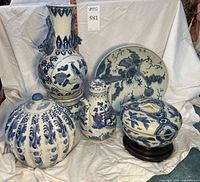 Group shot of all porcelain pieces and stands