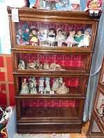 Front view showing four glass doors and bottom drawer