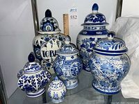 Group shot of six blue and white porcelain ginger jars