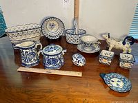 Group shot of all blue and white porcelain pieces on table
