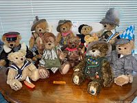 Front view of all eleven Hermann teddy bears arranged on table
