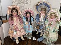Group shot of all four Patricia Stevens Loveless dolls on stands