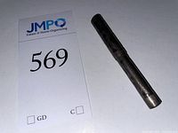 Capped pen beside lot tag