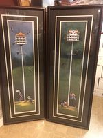 Full view of both framed birdhouse prints standing side by side