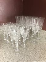 Sixteen matching cut crystal glasses in two sizes displayed together