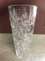 Full view of clear cut crystal vase showing starburst and pinwheel cuts