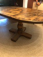 Table fully extended with leaf installed showing pedestal base