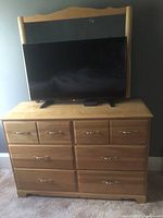 6-drawer dresser with mirror attached, television shown for scale