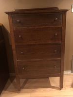 Front view of four-drawer wooden dresser
