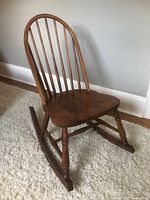 Front three-quarter view of wooden rocking chair