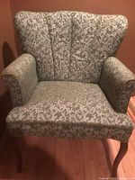 Front view showing fabric pattern, armrests, legs